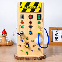 Thumbnail for TinyTech – Tablero de actividades de madera con luces e interruptores – Juguete educativo